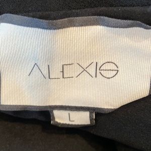 Alexis black off the shoulder top with silver zipper in back and bell sleeves